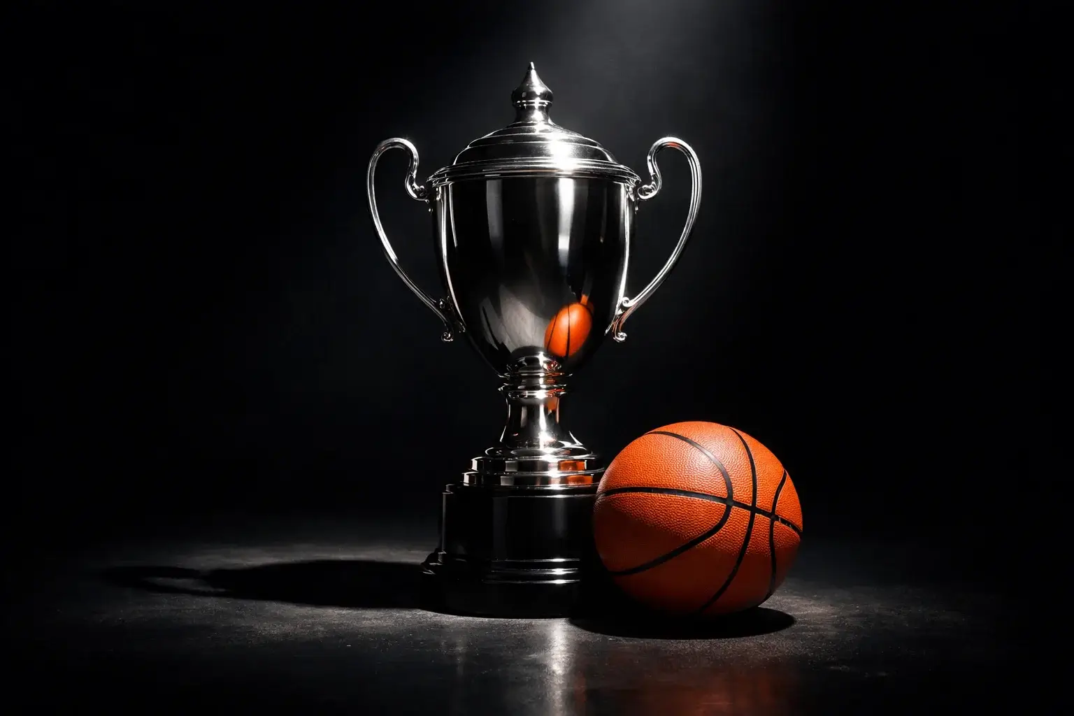 Basketbaltrofee in een spotlight als symbool voor het wedden op de kampioen